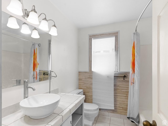 bathroom with tile patterned floors, a shower with shower curtain, vanity, and toilet