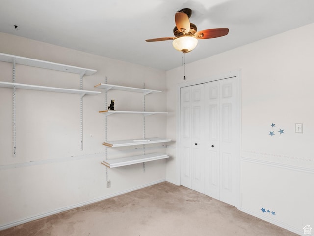 spacious closet featuring carpet flooring and ceiling fan