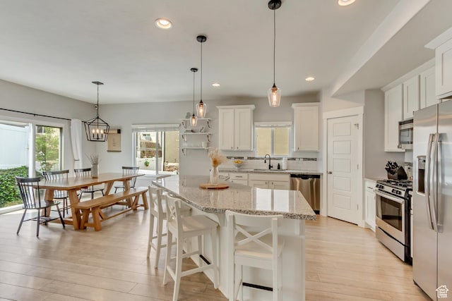238 E Hillcrest Way N, Salt Lake, UT 84054 - kitchen with appliances with stainless steel finishes, a sink, light wood-style flooring, recessed lighting, and white cabinets
