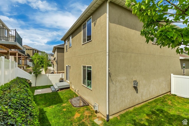 238 E Hillcrest Way N, Salt Lake, UT 84054 - view of property exterior featuring stucco siding, a wooden deck, and a residential view
