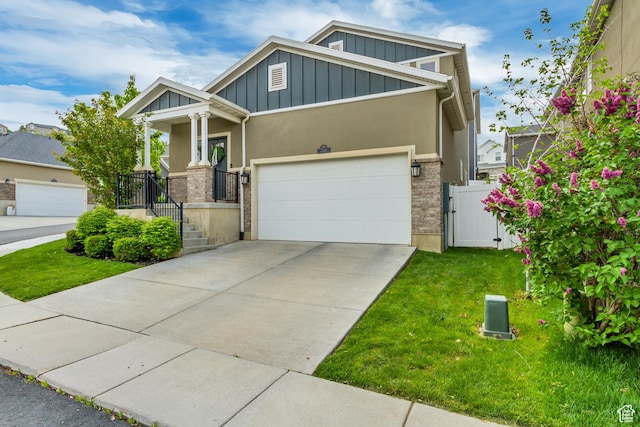 238 E Hillcrest Way N, Salt Lake, UT 84054 - craftsman inspired home with board and batten siding, a front lawn, a gate, concrete driveway, and stucco siding