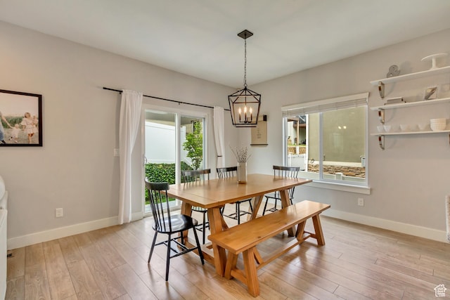 238 E Hillcrest Way N, Salt Lake, UT 84054 - dining area with a chandelier, light wood-type flooring, and baseboards