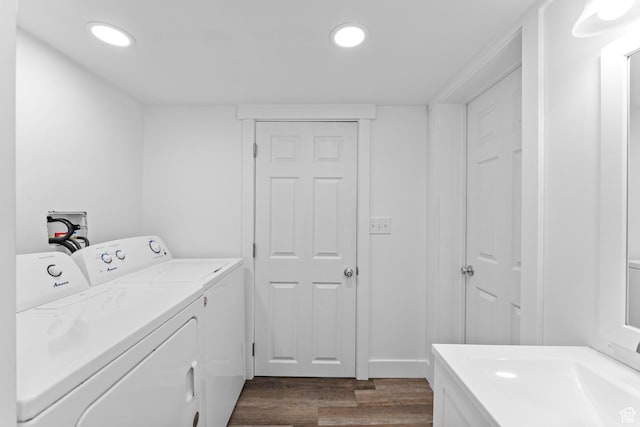 laundry area featuring dark wood-style floors, independent washer and dryer, and recessed lighting