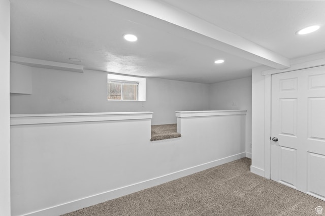 below grade area featuring recessed lighting, carpet flooring, and baseboards