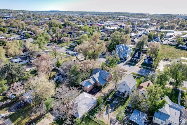 aerial view of property and surrounding area with nearby suburban area
