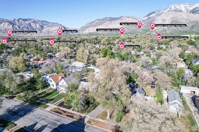 aerial overview of property's location featuring a mountainous background