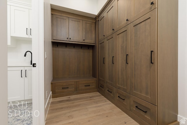 2832 E Stonedale Dr, St George, UT 84790 - mudroom featuring light wood-style floors and a sink