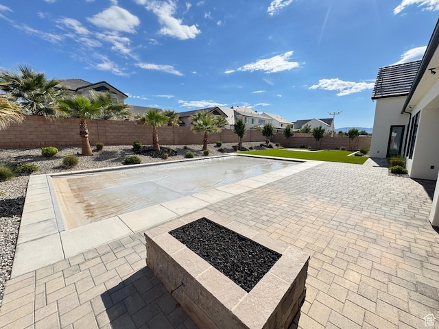 2832 E Stonedale Dr, St George, UT 84790 - view of swimming pool featuring a fenced backyard, a patio, a residential view, and a fire pit