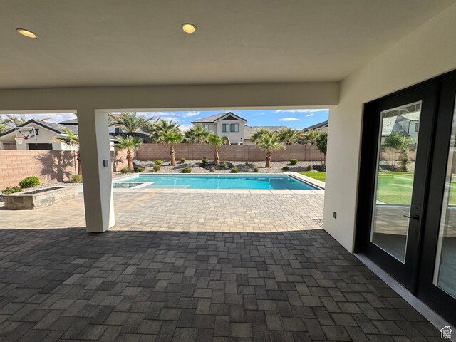 view of pool featuring a patio area and a fenced backyard