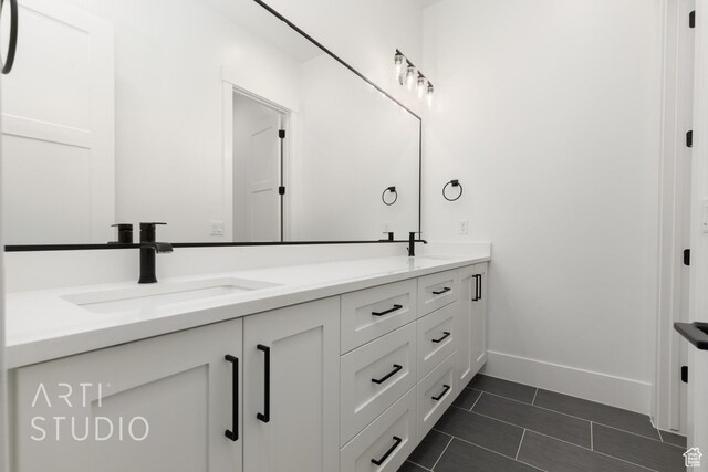 2832 E Stonedale Dr, St George, UT 84790 - bathroom featuring double vanity, tile patterned floors, and baseboards
