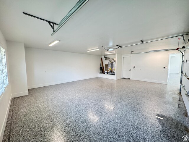 2832 E Stonedale Dr, St George, UT 84790 - garage with baseboards and a garage door opener