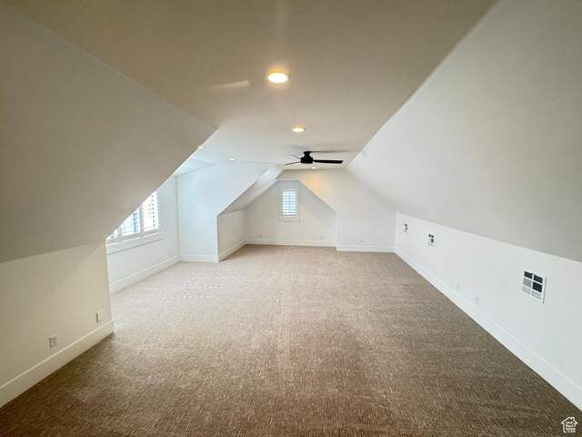 bonus room featuring carpet flooring, vaulted ceiling, baseboards, healthy amount of natural light, and recessed lighting