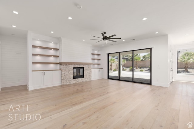 2832 E Stonedale Dr, St George, UT 84790 - unfurnished living room featuring recessed lighting, baseboards, light wood-style floors, built in shelves, and a ceiling fan