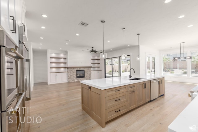 2832 E Stonedale Dr, St George, UT 84790 - kitchen with a sink, open floor plan, recessed lighting, a ceiling fan, and light brown cabinetry