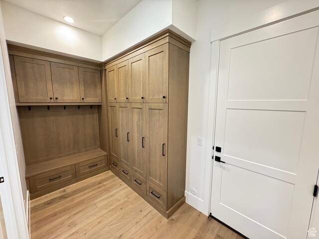 mudroom with light wood-style flooring and recessed lighting