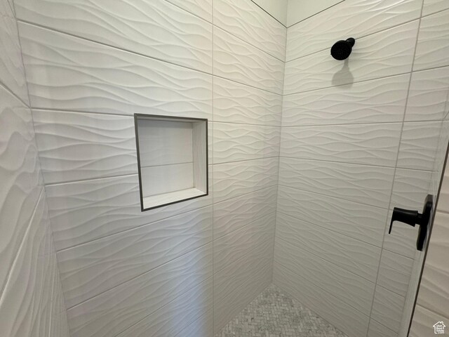 full bathroom with a tile shower