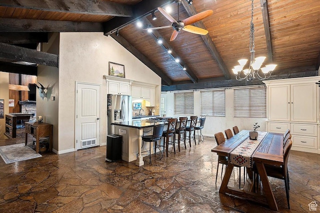 5925 W Highland Dr N, Mountain Green, UT 84050 - dining area with stone tile flooring, wood ceiling, a chandelier, high vaulted ceiling, and beamed ceiling
