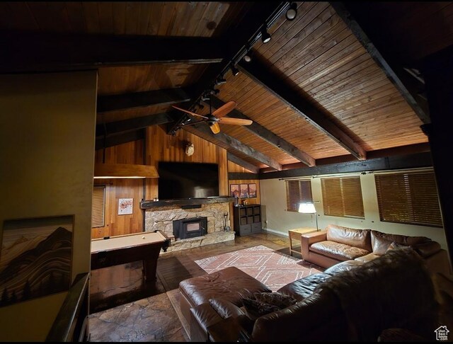 5925 W Highland Dr N, Mountain Green, UT 84050 - living room featuring track lighting, wood ceiling, wooden walls, ceiling fan, and a fireplace