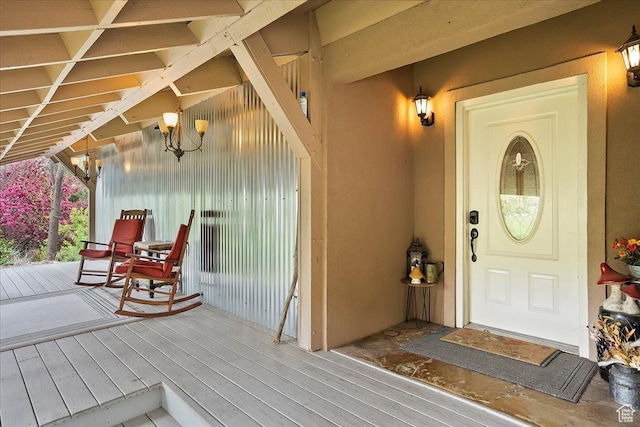 5925 W Highland Dr N, Mountain Green, UT 84050 - view of exterior entry with a porch and stucco siding