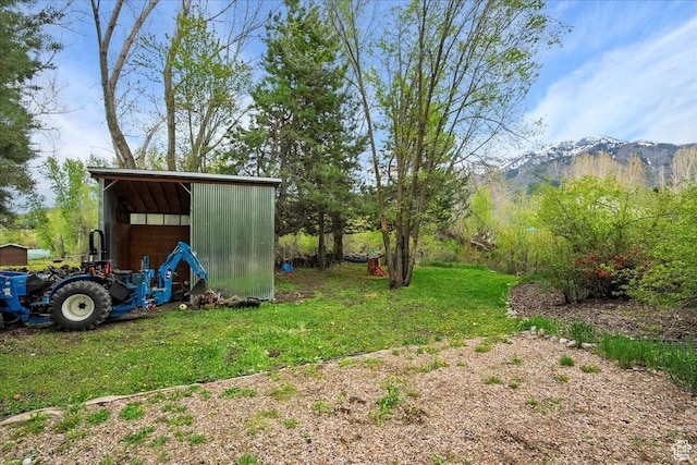 5925 W Highland Dr N, Mountain Green, UT 84050 - view of green lawn with an outbuilding and a mountain view