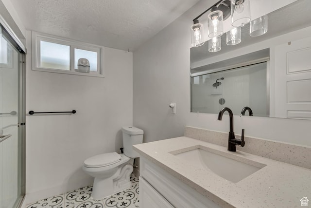 172 E 400 N, Tooele, UT 84074 - bathroom featuring a stall shower, toilet, a textured ceiling, tile patterned flooring, and vanity