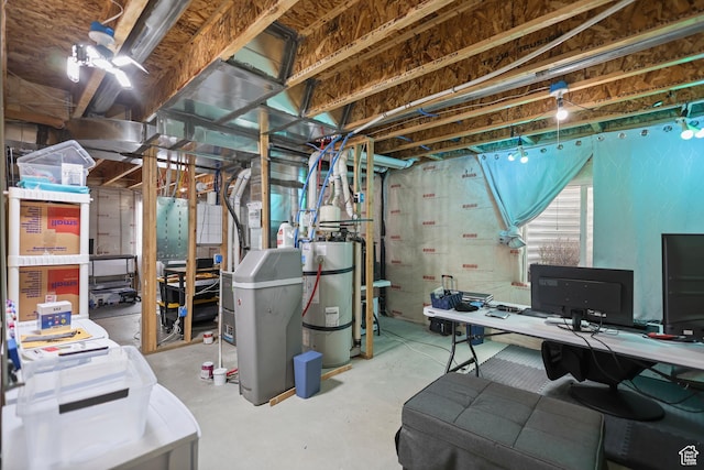 below grade area featuring secured water heater and an office area