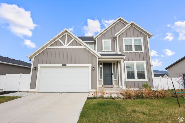 6366 N Wanlass Hl, Eagle Mountain, UT 84005 - craftsman house with board and batten siding, driveway, and an attached garage