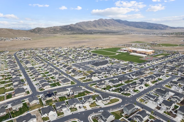 aerial view of property and surrounding area with a mountainous background