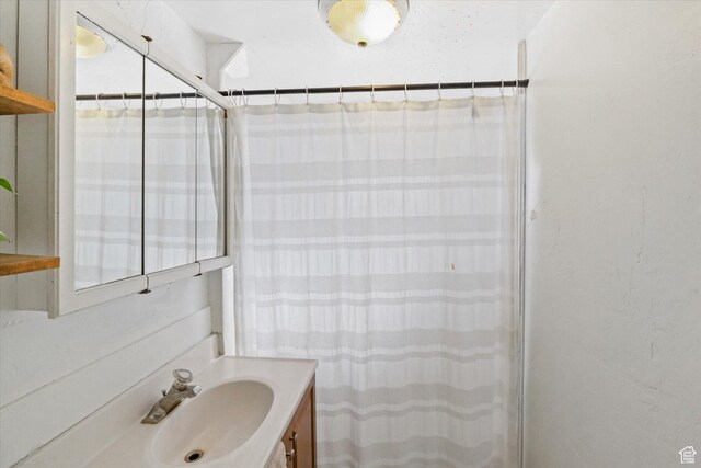 bathroom with vanity and a shower with curtain