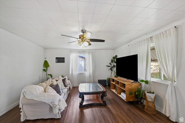 living area featuring wood finished floors and ceiling fan