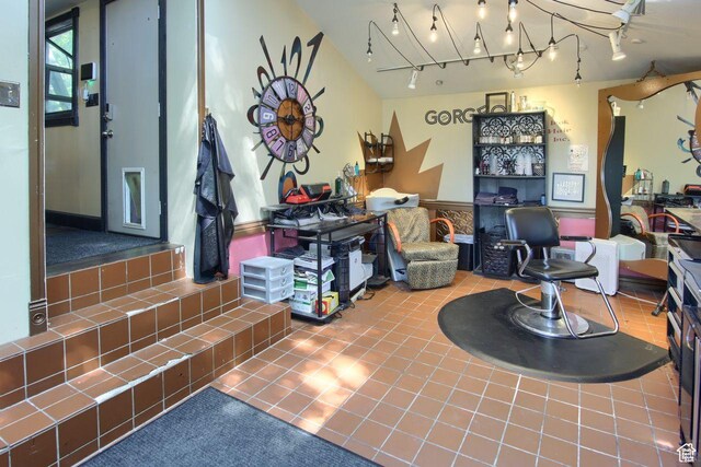 misc room featuring tile patterned flooring and rail lighting