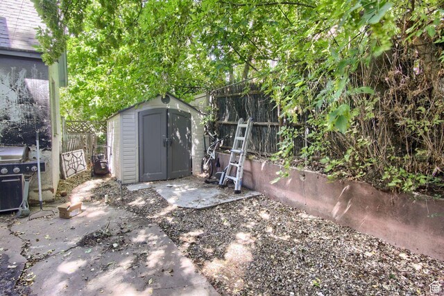 view of shed with fence