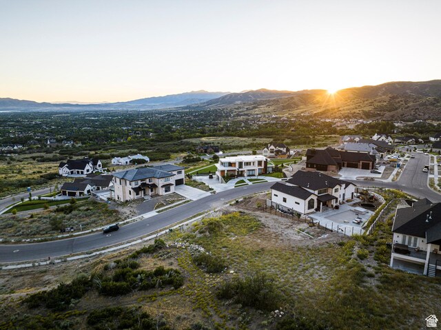 aerial view of residential area featuring mountains