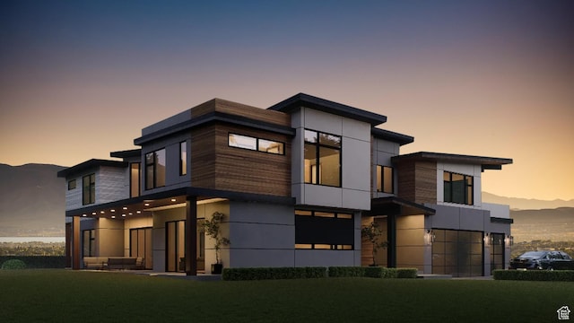 modern home featuring stucco siding and a balcony