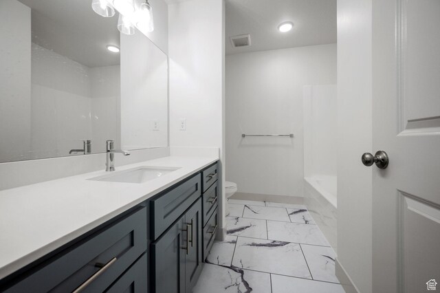 621 S 85 E Unit 24, Smithfield, UT 84335 - bathroom with marble look tiles, vanity, toilet, recessed lighting, and baseboards