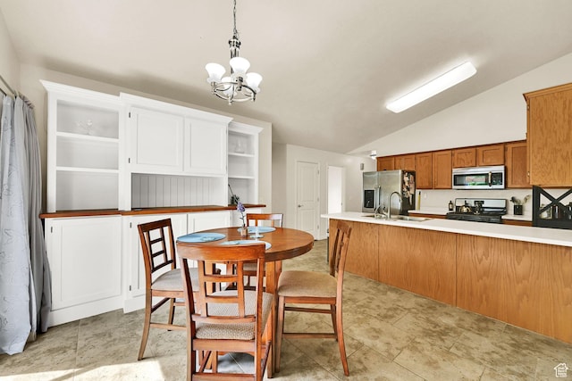 157 W Southwell St, Ogden, UT 84404 - dining room featuring lofted ceiling and a chandelier