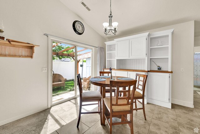 157 W Southwell St, Ogden, UT 84404 - dining room featuring a chandelier, lofted ceiling, baseboards, and light tile patterned floors