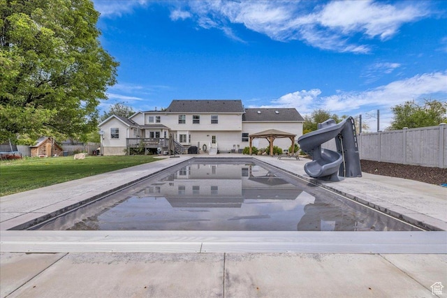view of pool featuring a water slide and a gazebo