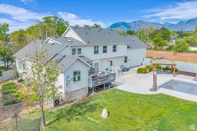 back of house featuring a gazebo, a patio area, and a mountain view
