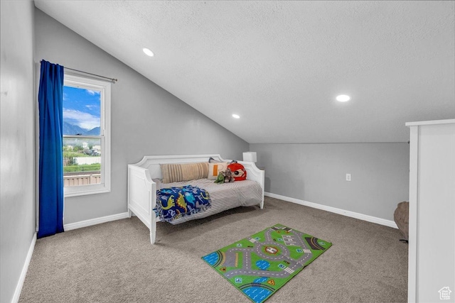 bedroom with lofted ceiling, a textured ceiling, carpet, baseboards, and recessed lighting