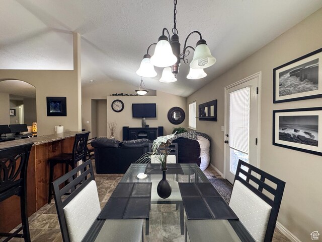 1661 S 1960 E, Spanish Fork, UT 84660 - dining space featuring arched walkways, lofted ceiling, a chandelier, and baseboards