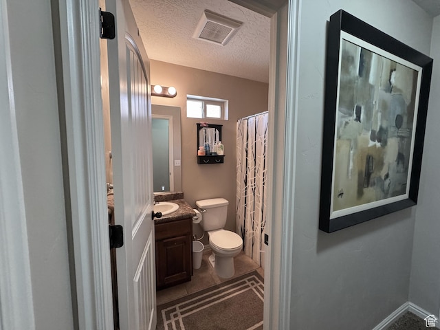 1661 S 1960 E, Spanish Fork, UT 84660 - bathroom with toilet, vanity, a textured ceiling, a shower with curtain, and tile patterned flooring