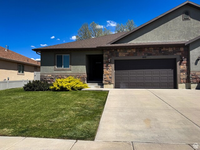 1661 S 1960 E, Spanish Fork, UT 84660 - ranch-style home featuring stone siding, stucco siding, an attached garage, driveway, and a shingled roof