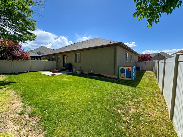 1661 S 1960 E, Spanish Fork, UT 84660 - back of property with a patio, a fire pit, and stucco siding