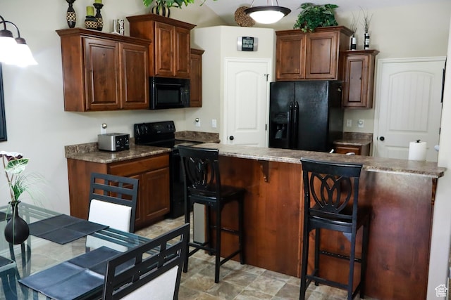 1661 S 1960 E, Spanish Fork, UT 84660 - kitchen featuring black appliances and a kitchen bar
