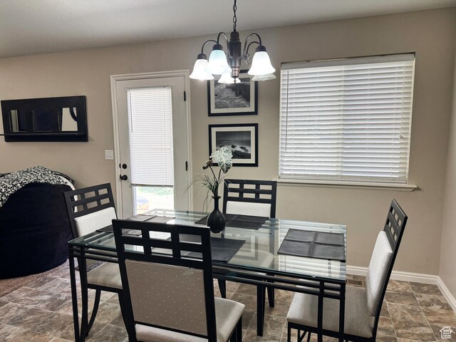 1661 S 1960 E, Spanish Fork, UT 84660 - dining space featuring a chandelier, stone finish floors, and baseboards