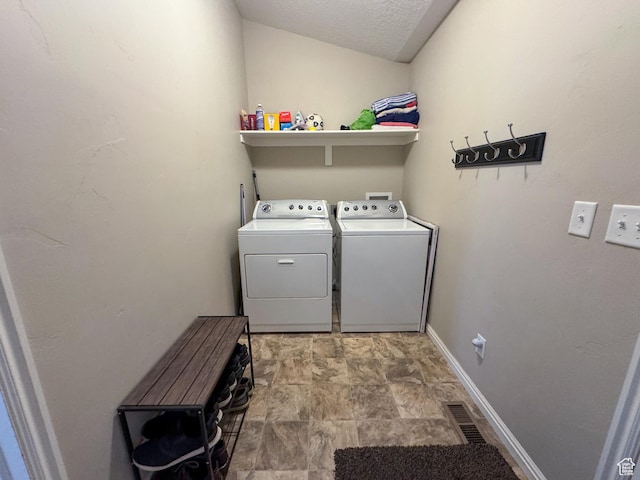 1661 S 1960 E, Spanish Fork, UT 84660 - laundry area featuring washer and clothes dryer, stone finish flooring, baseboards, and a textured ceiling