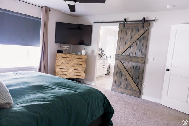 14944 S Beckham Dr W, Herriman, UT 84096 - bedroom with a barn door, light carpet, and ceiling fan