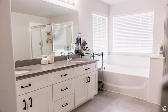 14944 S Beckham Dr W, Herriman, UT 84096 - full bathroom featuring a shower stall, a bath, double vanity, and tile patterned flooring