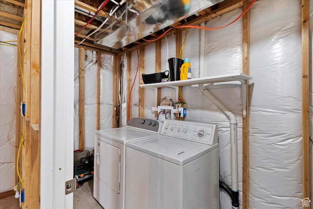 clothes washing area with washer and dryer